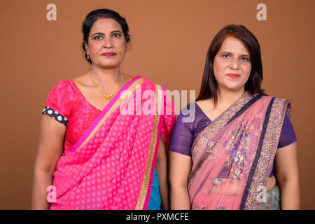 Two mature Indian women wearing Sari Indian traditional clothes  Stock Photo