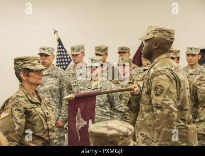 Lt. Col. Pamela Lawson, commander, 7218th Medical Support Unit, uncovers her unit’s guidon signifying the unit’s transfer of authority from the 7223rd MSU at the Fort Bliss and Old Ironsides Museum, June 9. The 7218th MSU is based out of Louisville, Kentucky. Stock Photo