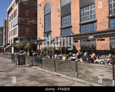 The Aker Brygge area in the centre of Oslo Norway has many restaurants with fjord view, outdoor seating essential on a sunny day, here !Louise ' Stock Photo