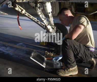 Senior Airman Brandon Murdaugh, a 455th Expeditionary Aircraft Maintenance Squadron crew chief, reviews a technical order at Bagram Airfield, Afghanistan, June 16, 2017. A technical order provides guidance and step-by-step instructions on how to conduct certain maintenance procedures. Stock Photo