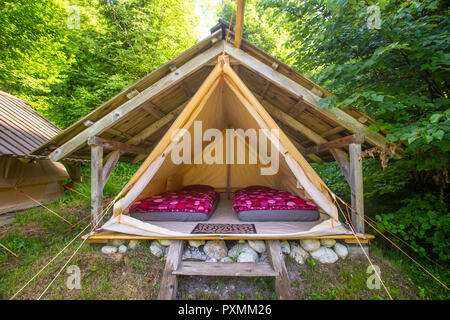 Interior Of Tent Cabin In The Woods With Two Chairs And Table On