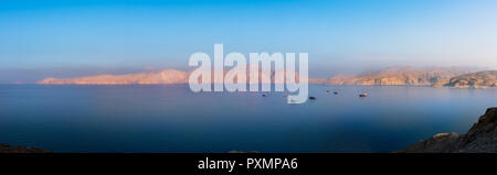 Panorama of idylic sunset over Fjords near Khasab in Oman Stock Photo