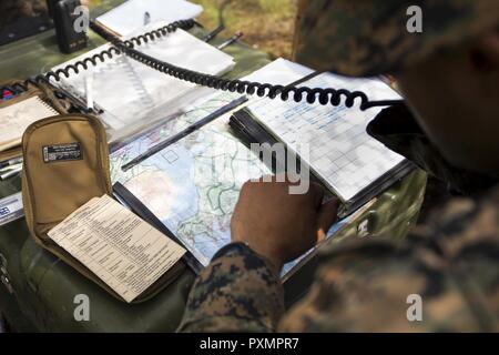 A marine communicates over the radio Stock Photo - Alamy