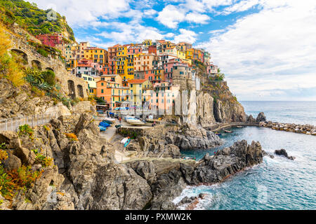 Manarola Village, Cinque Terre Coast of Italy. Manarola a beautiful small town in the province of La Spezia, Liguria, north of Italy and one of the five Cinque terre travel attractions, Sunset colors Stock Photo