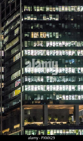 Illuminated offices at Singapore's business district late in the evening Stock Photo
