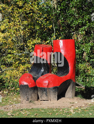 Wooden sculpture called Foot in both camps at Inch field beside Cahir Castle, Cahir County Tipperary, Ireland Stock Photo