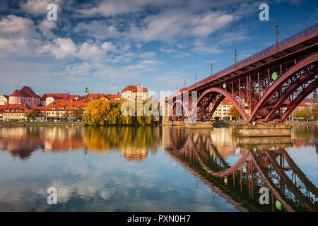 Maribor, Slovenia. Cityscape image of Maribor, Slovenia during autumn day with reflection of the city in Drava River. Stock Photo