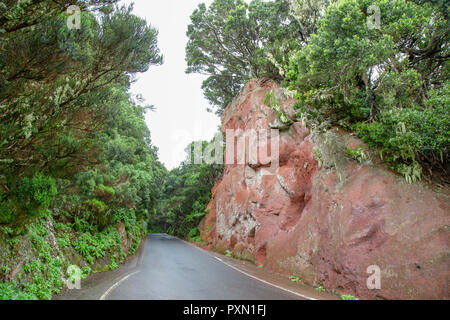 A road between red rocks in Anaga mountines, Tenerife, Canary Islands, Spain Stock Photo