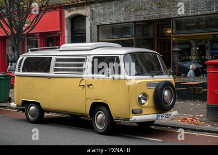 Yellow and white Volkswagen Campervan parked in Edinburgh's Old Town. Stock Photo