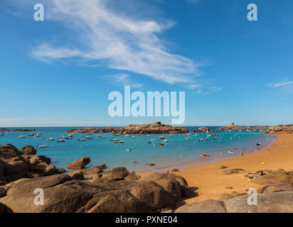 France, Brittany, Cote de Granit Rose (Pink Granite Coast), Cotes d'Armor, Tregastel, bay with boats Stock Photo