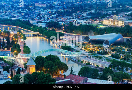 Bridge of Peace and the Mtkvari river. On the right, the Rike Park Music Theatre and Exhibition Hall and the Presidential Palace. Tbilisi, Georgia. Caucasus Stock Photo