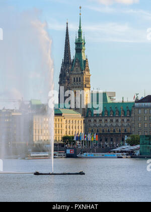 Germany, Hamburg, city hall and St Nikolai Memorial with Inner Alster and Alster fountain in the foreground Stock Photo