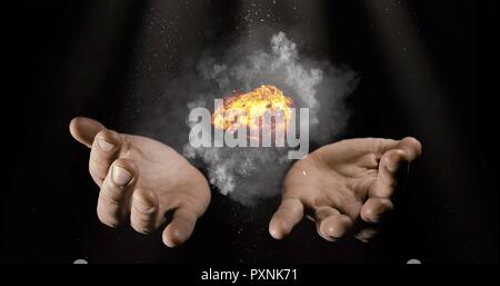 Modern magician conjuring smoke from his hands, Magic Trick Concept Stock Photo