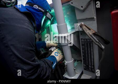 6 PACIFIC OCEAN (June 10, 2016) Hull Technician 1st Class Jennifer Deitrick, from Mentor, Ohio, welds a metal platform to the bulkhead aboard the Ticonderoga-class guided-missile cruiser USS Princeton (CG 59). Princeton is currently underway as part of the Nimitz Carrier Strike Group on a regularly scheduled deployment to the Western Pacific and Indian Oceans. Stock Photo