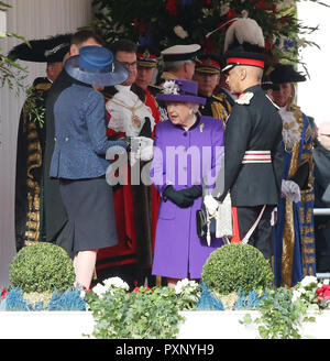 Prime Minister Theresa May (left) talks with Queen Elizabeth II at Horse Guards Parade, London, ahead of the ceremonial welcome of King Willem-Alexander and Queen Maxima of the Netherlands for their state visit to the UK. Stock Photo