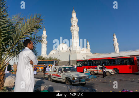 MEDINA, SAUDI ARABIA-CIRCA 2014 : Muslims at the compound of Masjid Quba in Medina, Saudi Arabia. This is the first mosque built by Prophet Muhammad ( Stock Photo