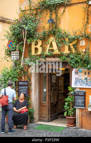 A colourful bar on the corner of  Vicolo Del Cinque in the Trastevere district of Rome, central Italy. Stock Photo