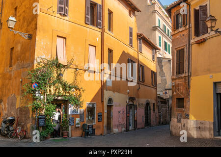 A colourful bar on the corner of  Vicolo Del Cinque in the Trastevere district of Rome, central Italy. Stock Photo