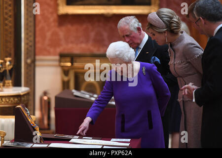 Queen Elizabeth II talks with Queen Maxima of the Netherlands as they view Dutch items from the Royal Collection at Buckingham Palace in London during the Dutch King and Queen's two-day state visit. Stock Photo