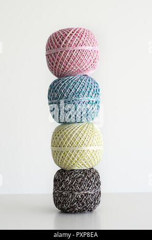 Colorful wool balls against bright white background, isolated Stock Photo