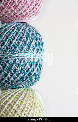 Colorful wool balls against bright white background, isolated Stock Photo