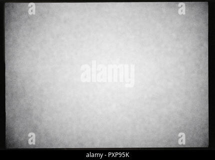 black and white photographic film frame background with heavy grain and light leak Stock Photo