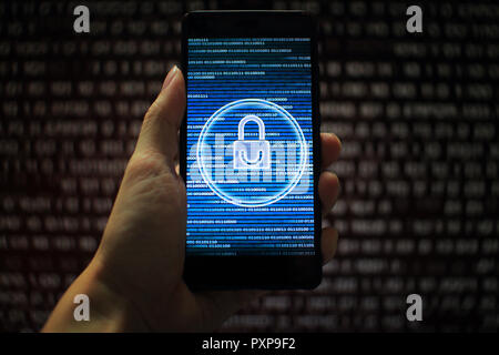 system integrity working while other pass down. hand holding mobile phone with padlock icon on blue binary code screen. Error message in computer. Stock Photo
