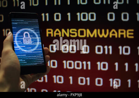 protected in stream of data flow. padlock icon symbolize security and red binary code computer data in the background with ransomware text. Stock Photo