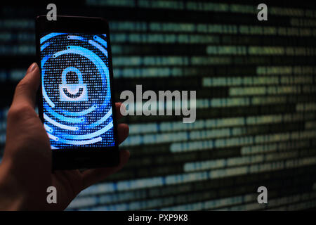 hand hold mobile phone flow. padlock icon symbolize security and motion movement of blue binary code computer data moving in the background. Stock Photo