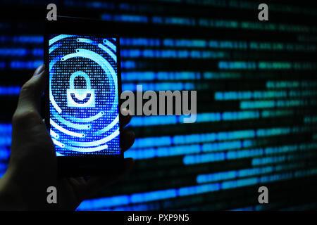 hand hold mobile phone flow. padlock icon symbolize security and motion movement of blue binary code computer data moving in the background. Stock Photo