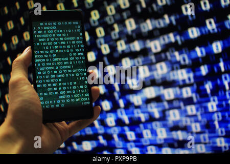 Missing data. multiple layer of information on mobile screen some missing from screen and error occurred. binary code on mobile and computer screen Stock Photo