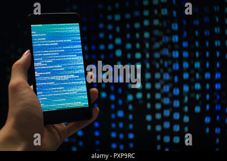 Missing data. multiple layer of information on mobile screen some missing from screen and error occurred. binary code on mobile and computer screen Stock Photo
