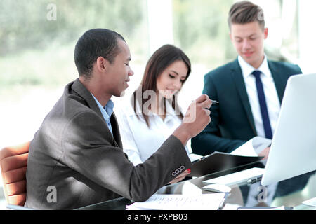 employees discussing new ideas in a modern office.t