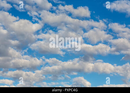 Beautiful blue sky with puffy white clouds - altocumulus Stock Photo