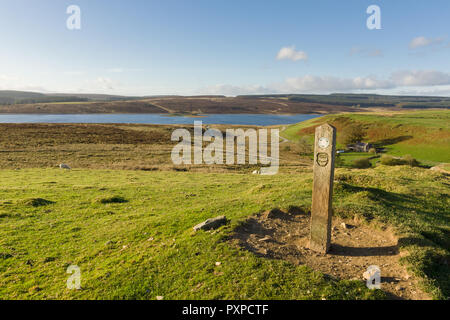 Walking guide post at Llyn Brenig reservoir in the Denbigh moors for the archaeological trail showing visitors bronze age monuments in the area Stock Photo