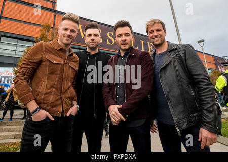 (left to right) Nicky Byrne, Markus Feehily, Shane Filan, and Kian Egan of Westlife, outside the SSE Arena, Belfast, ahead of the press conference for tickets going on sale for their reunion tour Stock Photo