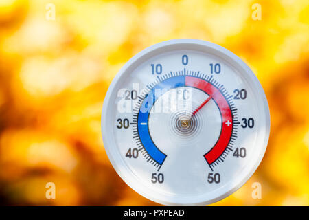 Outdoor thermometer  with celsius scale showing warm temperature - hot indian summer or global warming concept Stock Photo