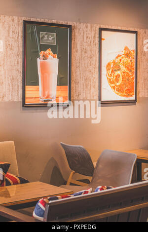 beautiful cosy cafe environment with tables and seating Stock Photo