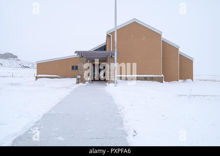 DECEMBER 31 2017 - BAYARD, NE: The Chimney Rock National Historic Site Visitors center during a winter snowstorm. Inside is a museum explaining the ro Stock Photo