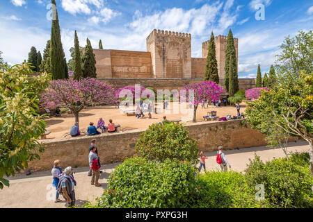 Granada, Andalucia, Spain - April 17, 2016: people and tourists around the Alcazaba de Granada, the military fortress of the Alhambra, in a sunny day. Stock Photo