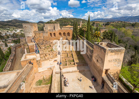 Granada, Spain - April 17, 2016: aerial view of people and tourists visiting the Alcazaba de Granada, the military fortress of Alhambra, one of the most visited attractions of Andalusia. Stock Photo