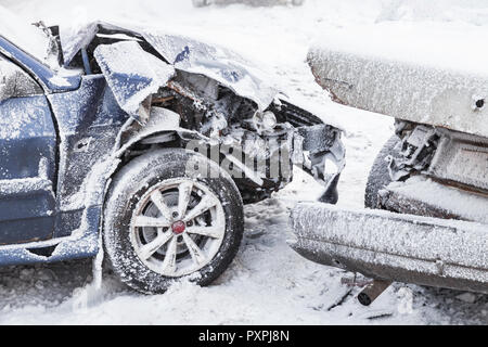 Crashed cars right after an accident on winter road with snow Stock Photo