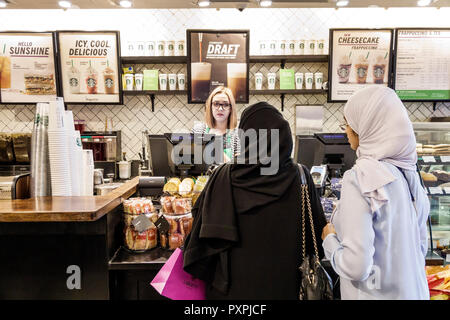 London England,UK,United Kingdom Great Britain,Soho Carnaby Street,Starbucks Coffee,cafe coffeehouse,counter,adult adults woman women female lady,cash Stock Photo