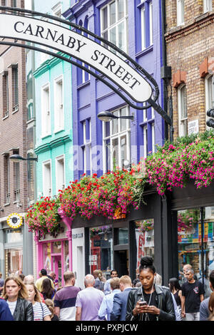 London England,UK,Soho Carnaby Street,pedestrian-only shopping street,flower planters,crowd,man men male,woman female women,UK GB English Europe,UK180 Stock Photo