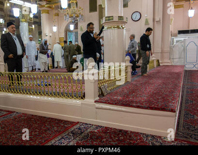 MEDINA, SAUDI ARABIA, CIRCA 2014 - Muslim pilgrims at the suffah platform. Suffah is a term for Prophet Muhammad's companions who are searching for Is Stock Photo