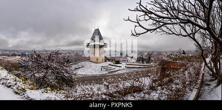 Landmark Uhrturm on hill Schlossberg in Graz on a snowy winterday Stock Photo