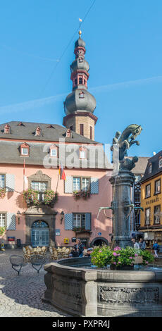 Ancient Town Hall building in the old town market square, Cochem, Germany, with St Martin's water fountain in the foreground Stock Photo