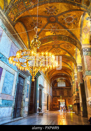 Tourists visiting The Narthex of the Hagia Sophia mosque, an inner hall of nine vaulted bays. Istanbul, Turkey. Stock Photo