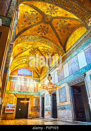 Tourists visiting The Narthex of the Hagia Sophia mosque, an inner hall of nine vaulted bays. Istanbul, Turkey. Stock Photo