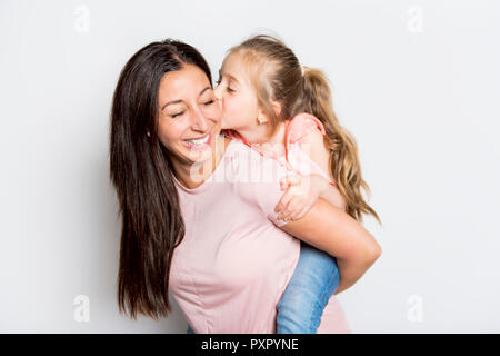 pretty mother standing with her cute daughter Stock Photo